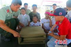 浙江海警开展警营开放日 与“小候鸟”共迎中国