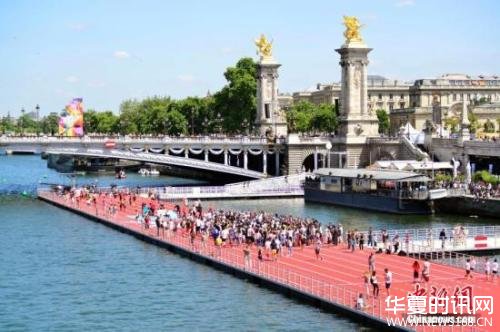 资料图：6月23日，正在申办2024年奥运会的巴黎市政府以塞纳河和著名的亚历山大三世桥为“舞台”举行“奥林匹克日”活动。中新社记者 龙剑武 摄